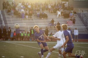 Kearney heads the ball towards their goal.
