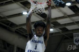 DJ Jamerson (UNK) slams the ball through the hoop.