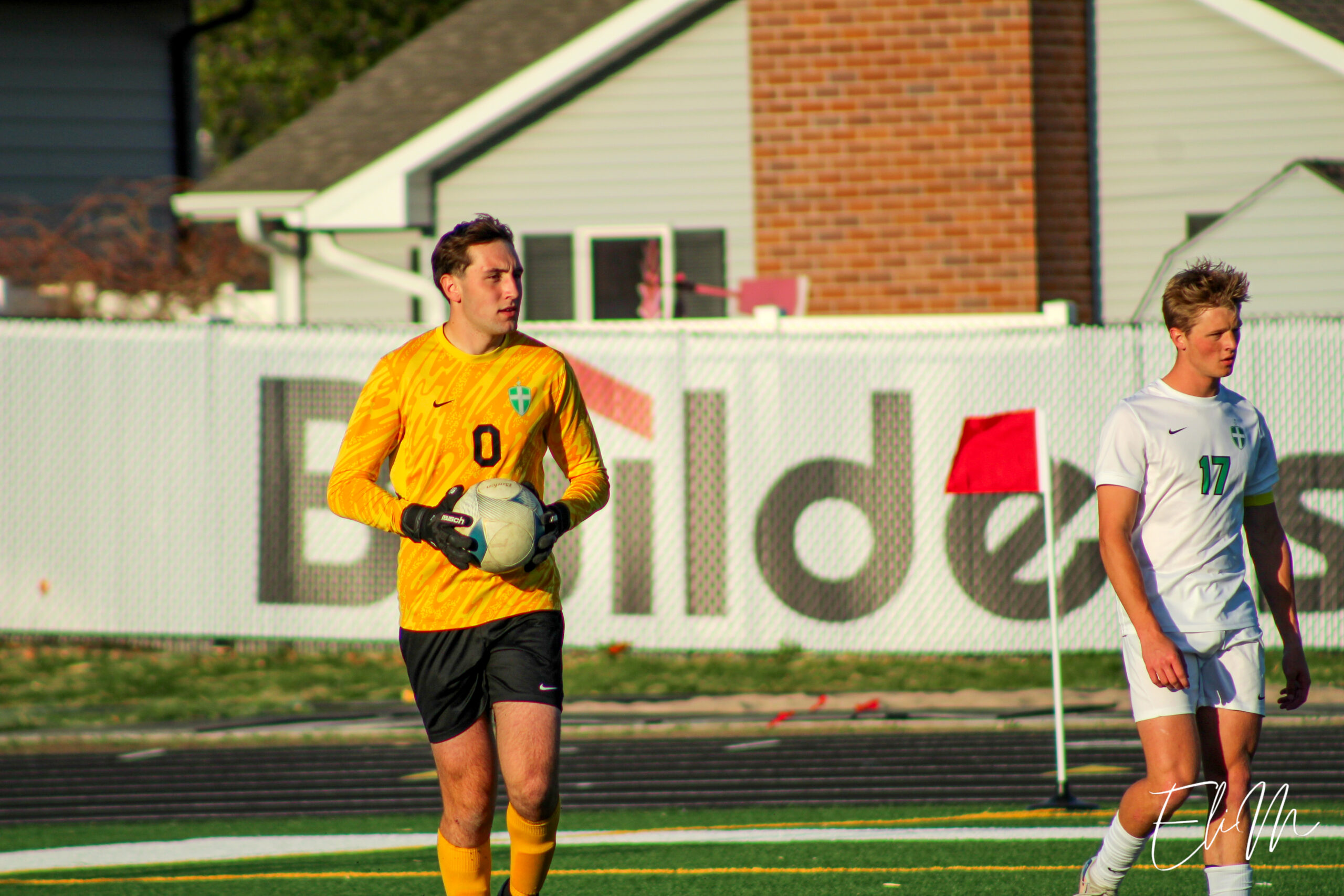 Carson Wessel (Scotus CC) possesses the ball after making a save.